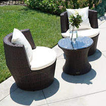 Outdoor creative designer model room rattan table and chair garden balcony courtyard hotel rattan chair three-piece set combination