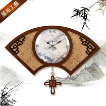 New Chinese wood bedroom wall clock Chinese style rattan fan-shaped quartz clock clock living room silent hanging watch
