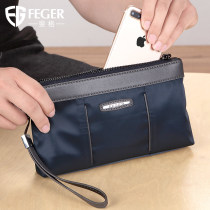 Mens hands with bag Bag Canvas Large Capacity Oxford Cloth Wrist Bag Fashion Mobile Phone Bag Casual Mens Handbag Man