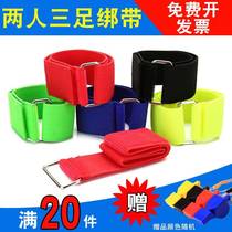  Four people with five feet tied with a concerted pair of three foot sports games props tied leg and running tape gathering to live