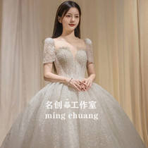 Main wedding dress 2021 new bride temperament court style luminous high-end heavy industry cover arm French starry princess style