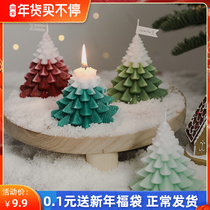 Small Christmas tree candle gift box with hand gift ins photo props photography background ornaments decorative scented candles