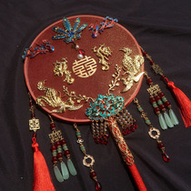 The bride holds the wedding ceremony fan the finished flower the red Chinese style the ancient wind the fan the show