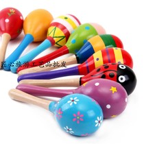 Baby hand holding educational toy Orff musical instrument wooden cartoon sand ball wooden sand hammer exercise hearing rattle
