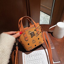 New South Korean version Mini child girl English letter small bucket hand sloped satchel bag Girl Bag Tide