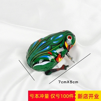 Green little jumping frog clockwork frog baby crawling childrens tin shaking sound with the same baby toy super cute 