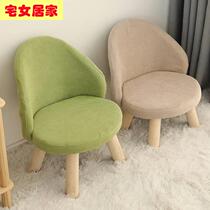 Adult sits in a small chair backwards bedroom backwards comfortable girl lovely household solid baby bench