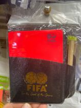 Football match red and yellow foul card fluorescent card send score book and pencil