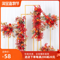 Wedding orange point floral set Wedding hall finished flowers Red stage background floral flowers row by row road leading flowers