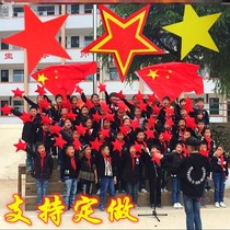 Children perform with the choir red five-pointed star Red five-star performance props dance with red star holding in hand