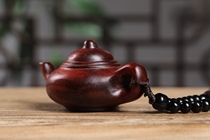 Authentic leaf sandalwood handle hands a fine teapot plate playing with a handy piece of sandalwood playing artwork men