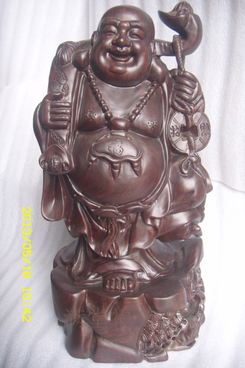 Milford laughs at the Buddhas wood carvings of ebony home Buddha statues