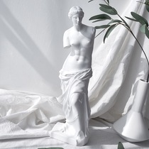 The Venus figure plaster is like a 29cm human plaster full body like a painting sketch plaster like a geometric sculptural pendulum