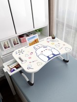 Small tables for large and small students to put on their beds for eating cute desks and laptops on their desks.