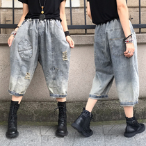 2021 autumn new large size loose hole denim pants European fashion high waist thin Capri pants women casual