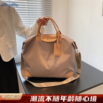 Versatile waterproof short trip handbag male and female luggage bag handbag for travel with light large capacity boarding bag